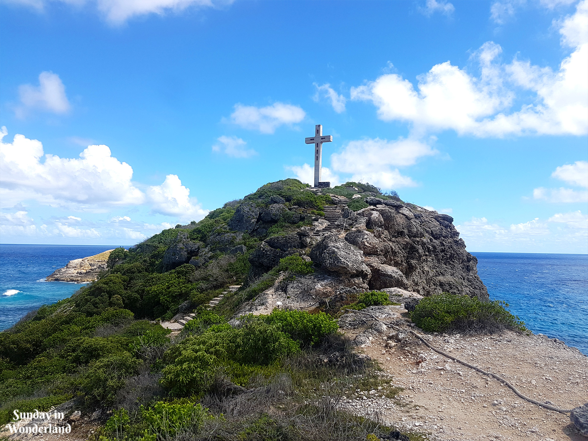 The heighest point on Pointe des Chateaux with the cross - Sunday in Wonderland Blog