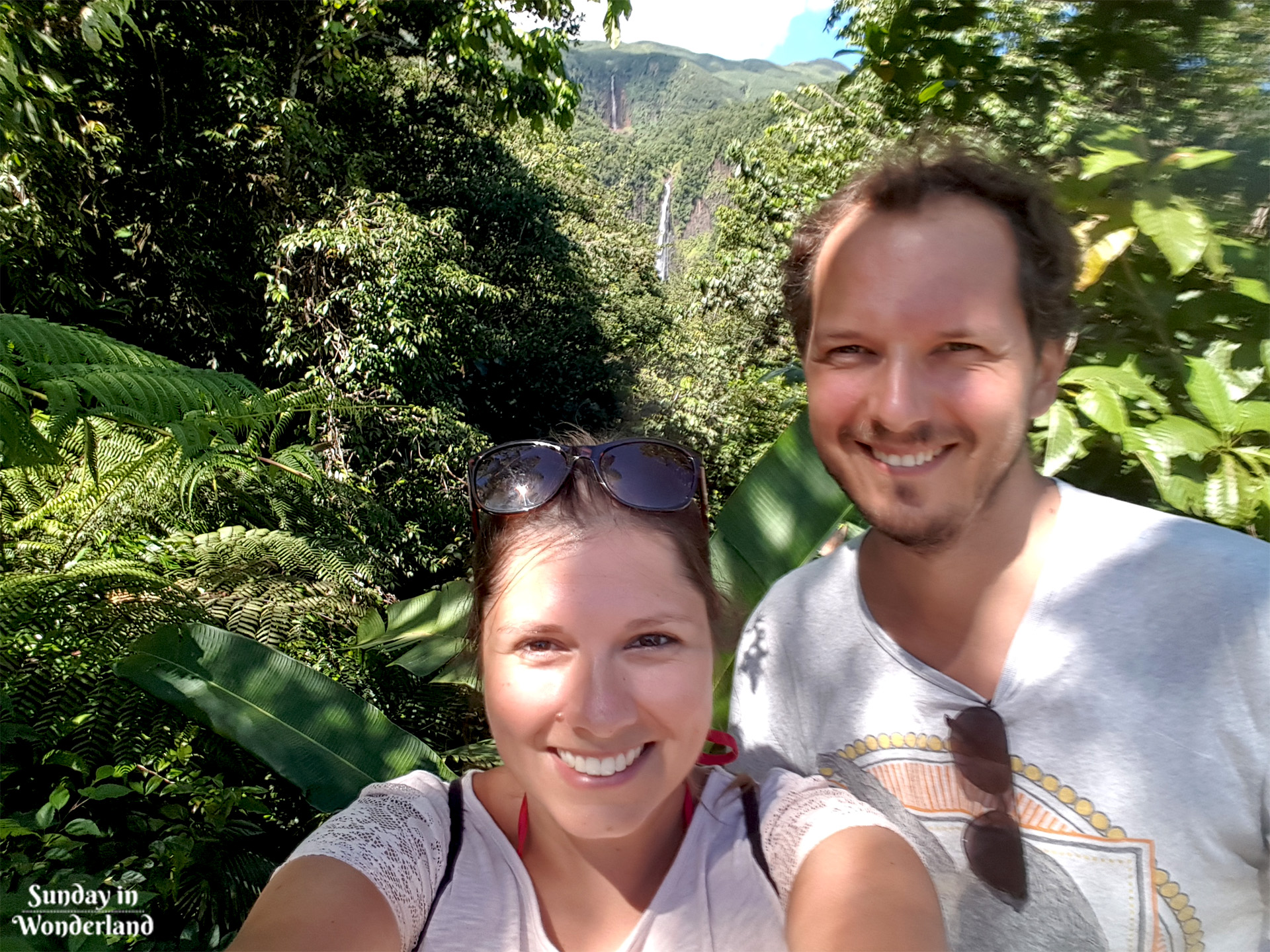 Dominika and Mariusz in front of Chutes du Carbet - Guadeloupe - Sunday in Wonderland Blog