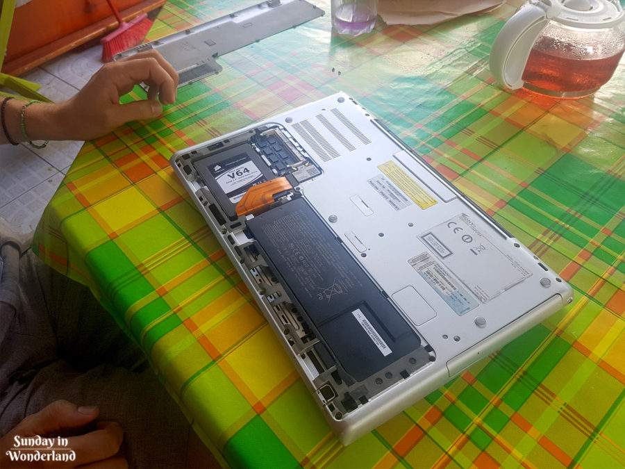 An opened laptop on a table - Guadeloupe - Sunday in Wonderland Blog - how to repair a computer in Guadeloupe