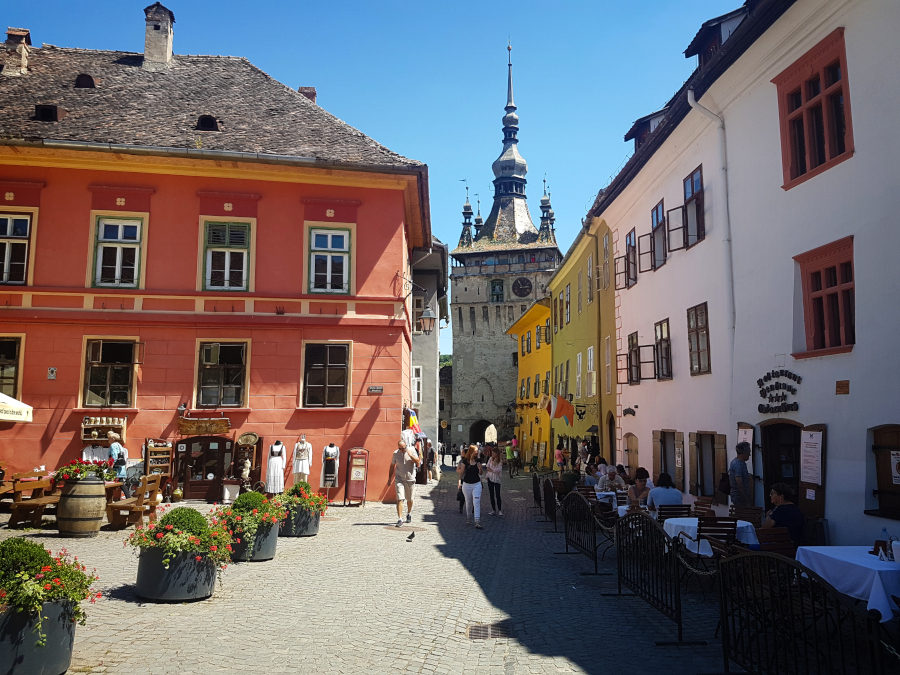 Charming street in Sighisoara with a view to the Clock Tower, Romania - Transylvania Road Trip Itinerary