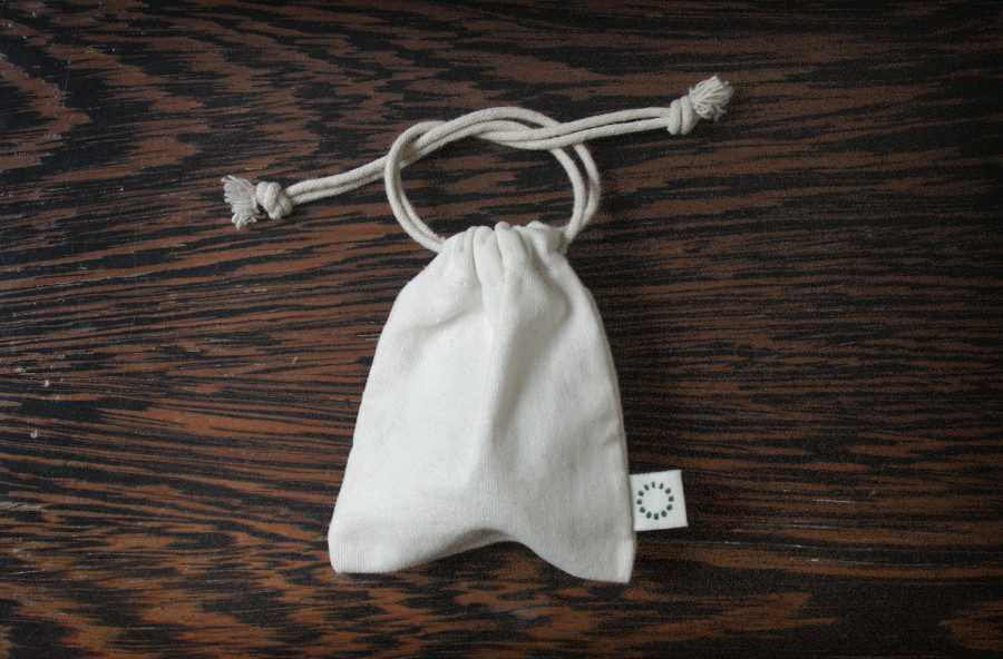 Menstrual cup in a cotton pouch