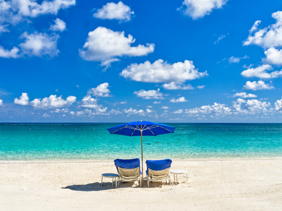 Two chairs on the beach - The ultimate Caribbean packing list for travel and Caribbean vacation