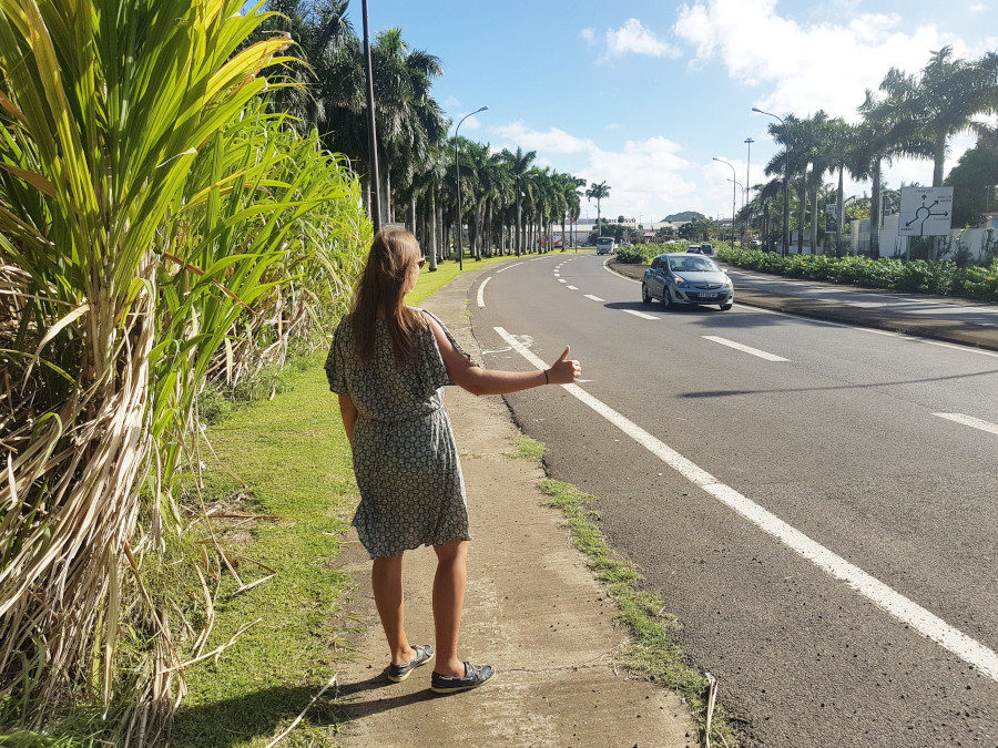 A girl hitchhiking in Martinique, the Caribbean