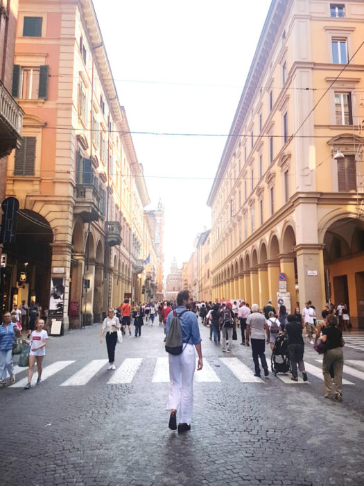 A crowdy street in Bologna, Italy, with porticoes and arcades. - The Northern Italy Itinerary