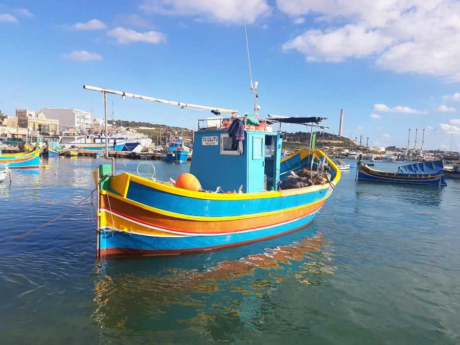The colorful boat on the water in Marsaxlokk in Malta
