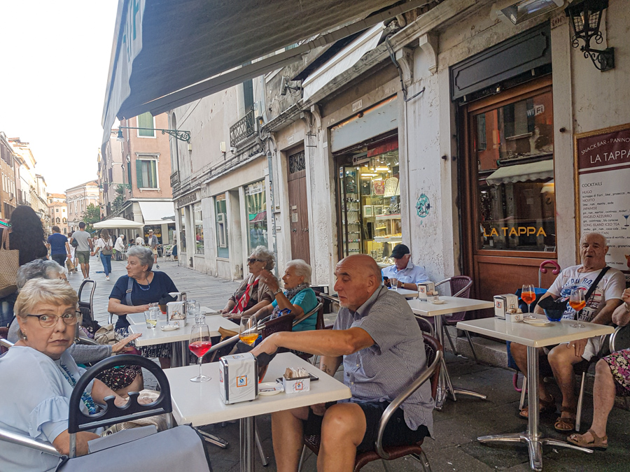 Elderly Venetians having drinks in Venice
