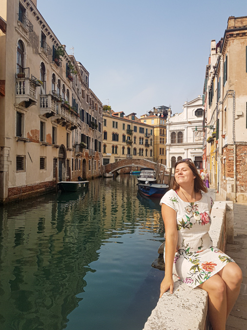 Sunday In Wonderland sitting near the canal in Venice
