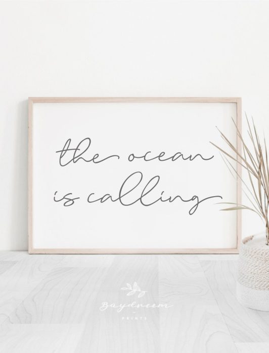 The ocean is calling inspiring beach quote in a frame
