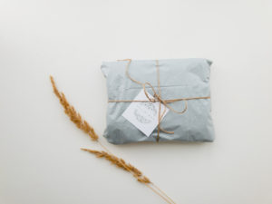 Eco-friendly gift wrapped in blue paper